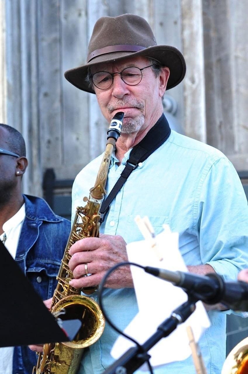 Bill Bixler playing saxophone outdoors