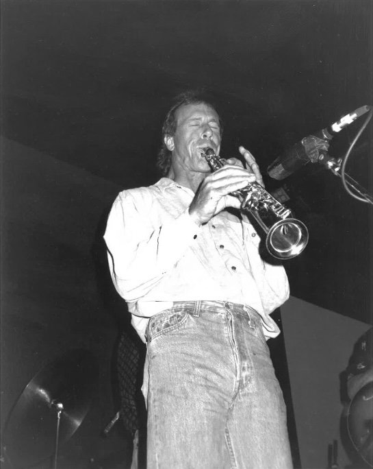 Bill Bixler playing soprano saxophone on stage